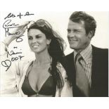 Caroline Munro as Naomi signed 10 x 8 inch b/w James Bond photo with Roger Moore. Good condition.
