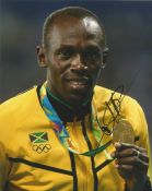 Usain Bolt retired Jamaican sprinter 10x8 signed colour photo. Good condition. All autographs come