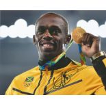 Usain Bolt retired Jamaican sprinter 10x8 signed colour photo. Good condition. All autographs come