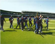 Cricket. Darren Gough Signed 10x8 colour photo. Photo shows England team celebrating after a win.