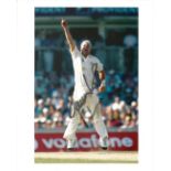 Cricket. Shane Warne Signed 10x8 colour photo. Photo shows Warne Celebrating during a Cricket Match.