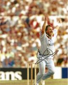 Cricket. Sir Ian Botham Signed 10x8 colour photo. Photo shows Botham during an England Cricket