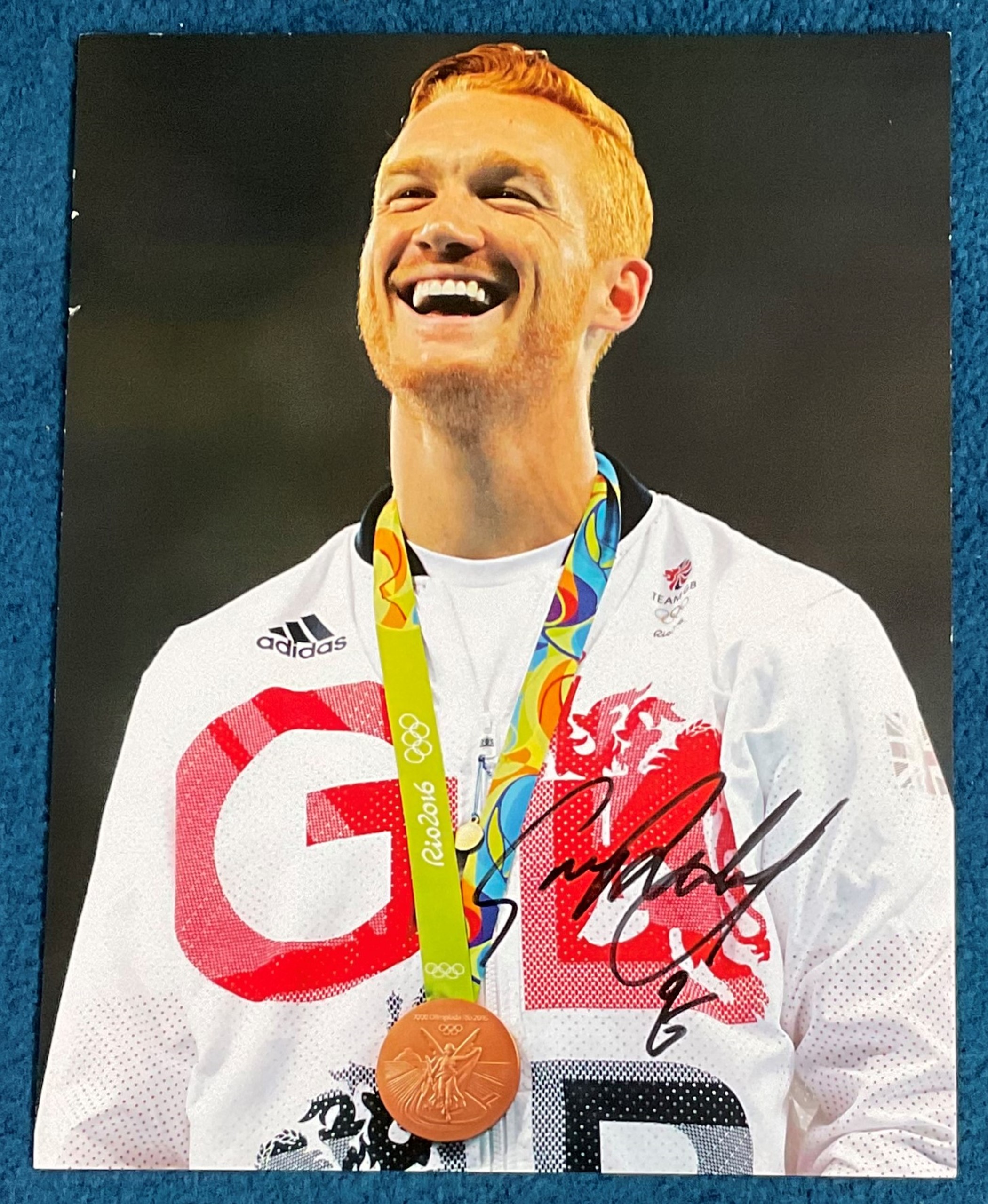 Athletics Greg Rutherford signed 14x11 Rio Olympics colour photo. Good condition. All autographs