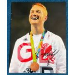 Athletics Greg Rutherford signed 14x11 Rio Olympics colour photo. Good condition. All autographs