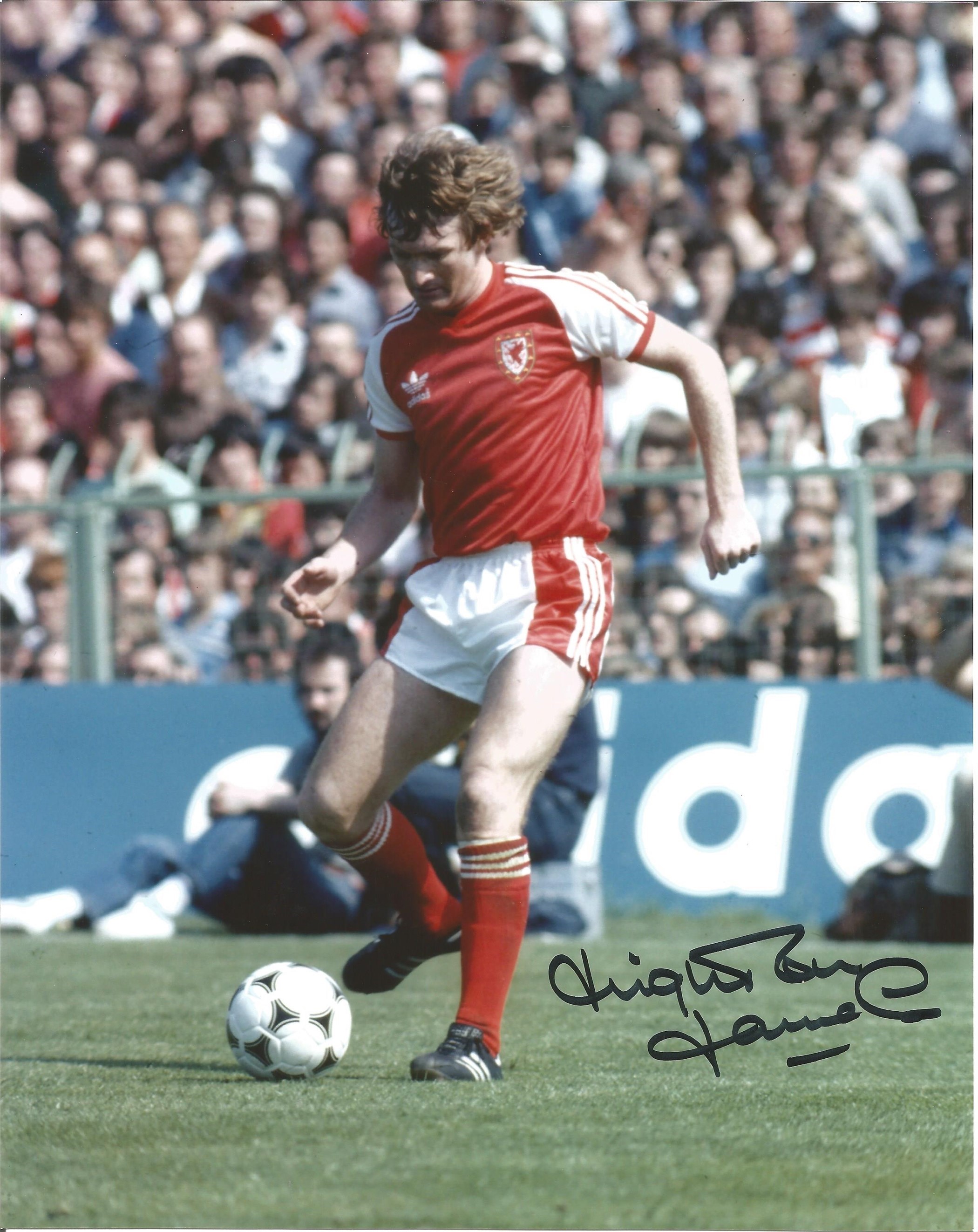 Leighton James signed 10x8 colour football photo pictured in action for Wales. Good condition. All