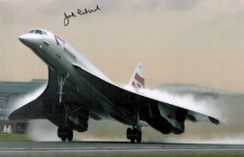 Concorde. A signed 10x8 colour photo. Signed by John Lidiard. Photo shows the Concorde taking off.