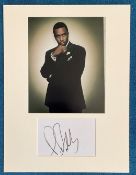 P. Diddy autograph mounted display. Mounted with photograph to approx. 16 x 12 inches overall.