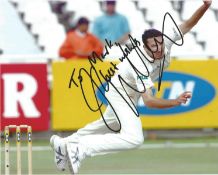 Jason Gillespie signed 10x8 action cricket bowling photo. Good condition Est.