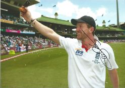 Cricket, Paul Collingwood signed 12x8 colour photograph pictured holding the ashes trophy.