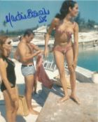 Martine Beswick signed 10x8 inch colour bikini photo from James Bond. Good condition Est.