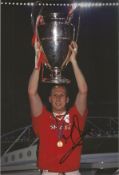 Jaap Stam signed 12x8 inch colour photograph pictured celebrating whilst holding the Champions