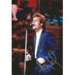 Huey Lewis signed 12x8 inch colour photo. Hugh Anthony Cregg III born July 5, 1950, known