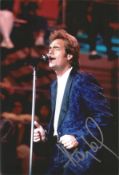 Huey Lewis signed 12x8 inch colour photo. Hugh Anthony Cregg III born July 5, 1950, known