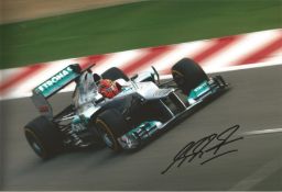 Michael Schumacher signed 12 x 8 inch colour motor racing photo. Good condition Est.