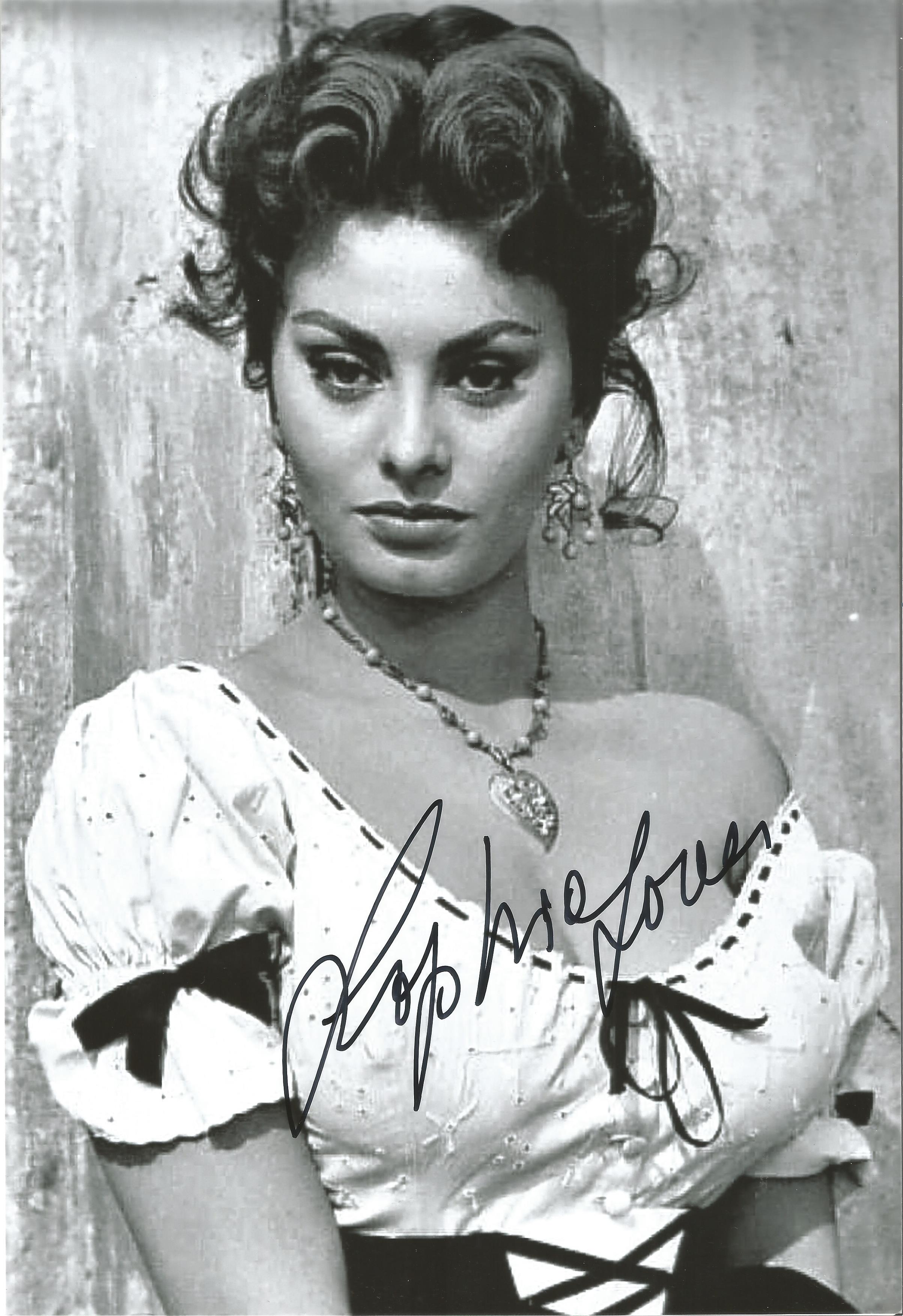 Sophia Loren signed sexy 12 x 8 inch black and white photo. Good condition Est.