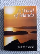 A World of Islands by Leslie Thomas hardback book with dust cover 208 pages signed and dedicated