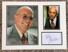Telly Savalas 16x12 approx Kojak mounted signature piece includes signed album page and two
