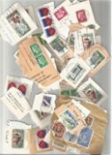 World stamps loose on backing paper. Good condition. We combine postage on multiple winning lots and