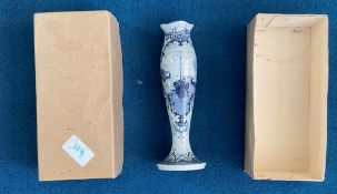 Tall blue and white vase with harbour scene painted. Stamped Delft on base. Good condition. We