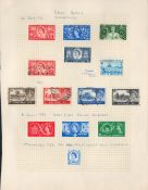 GB stamps 1953/1957 on loose album page. 14 stamps. Includes Coronation, scouts and high value defs.