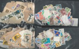World stamp collection loose on backing paper. Good condition. We combine postage on multiple