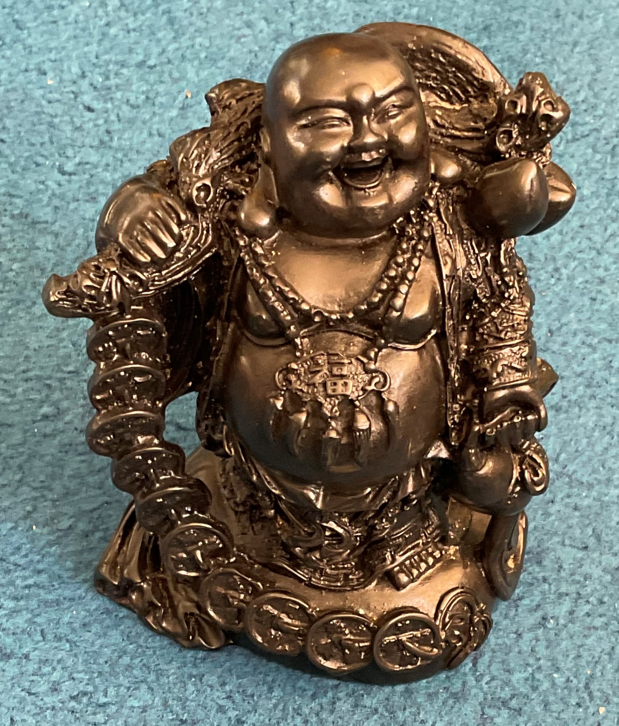 Black buddha carving. Approx 15cm in height. Good condition. We combine postage on multiple