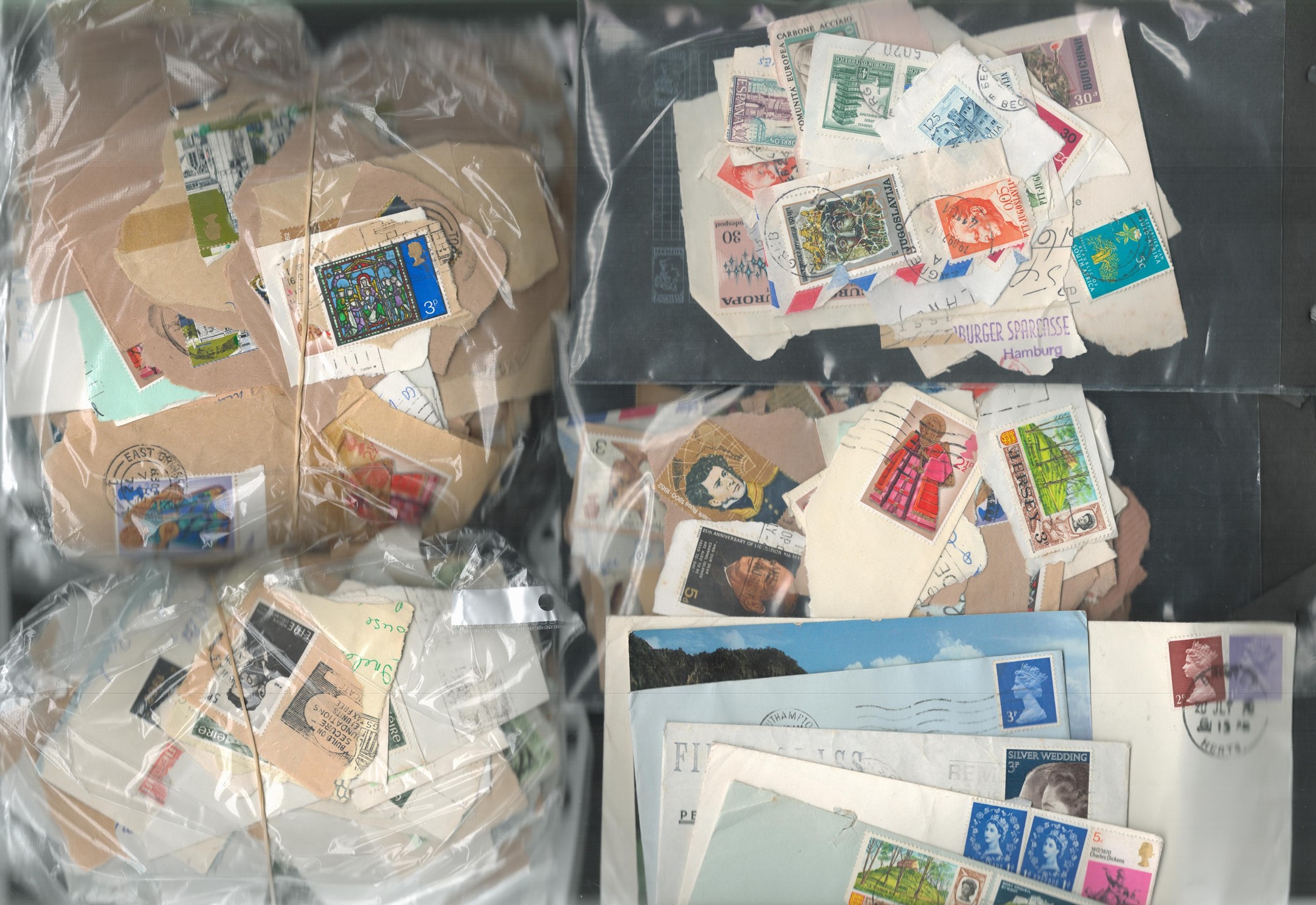 Assorted postage collection. Contains some covers and envelopes. Loose stamps on backing paper