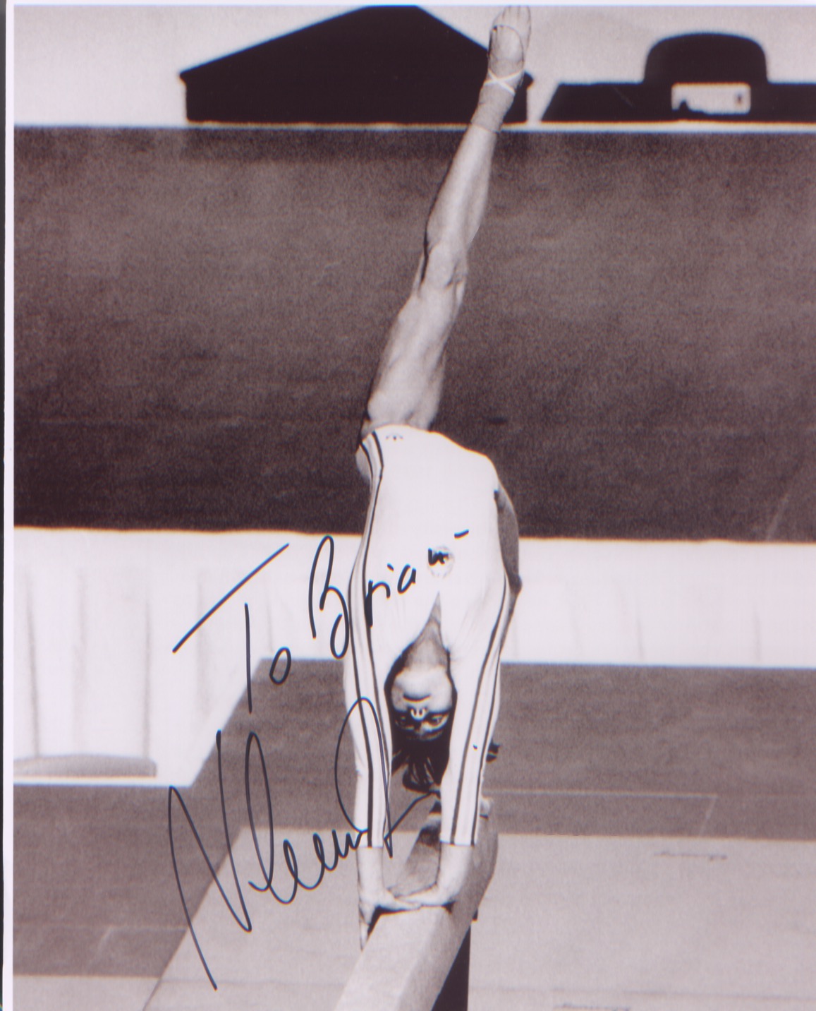 Nadia Commaneci signed 10 x 8 inch photo in action at the Olympic Games.Good condition. All
