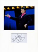 Michael McIntyre signature piece mounted below colour photo. Approx size 16x12.Good condition. All