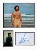 Aidan Turner signature piece mounted below colour photo. Approx size 16x12.Good condition. All