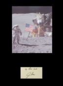 Apollo 15 James Irwin. Signature mounted with picture of James Irwin on the moon. Professionally