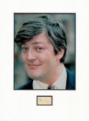 Stephen Fry small signature piece mounted below colour photo. Approx size 16x12.Good condition.