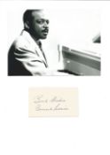 Count Basie signature piece stuck below 7x5 black and white photo.Good condition. All autographs