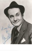 Henry McGee, actor and straight man to Benny Hill. A signed and dedicated 5.5x3.5 photo.Good