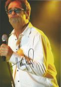 Huey Lewis signed 10x8 colour photo. Lewis sings lead and plays harmonica for his band, Huey Lewis