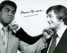 Michael Parkinson signed 10x8 black and white photo pictured with the Greatest Muhammad Ali. Good