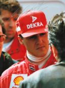 F1 Legend Michael Schumacher Hand signed 6x5 Colour Photo. Photo shows Schumacher in conversation