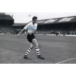 Autographed JOHN GROVES 12 x 8 photo - B/W, depicting the Luton Town wing-half striking a full