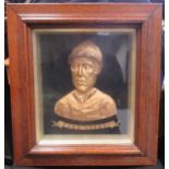 A gilt-metal head & shoulders bust of Fred Archer circa 1886, in high relief and inscribed Fred