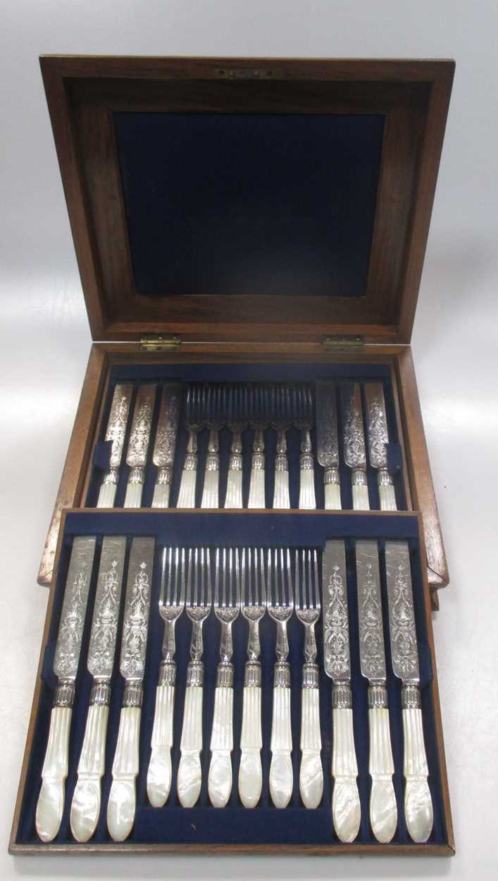 A canteen of mother of pearl handled dessert cutlery, 2 toastracks, 2 fans and early newpapers c.