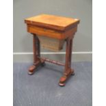 A 19th century rosewood work table, the rectangular rotating fold over top enclosing a fabric
