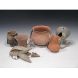 A group of Chinese "Neolithic' pottery vessels, including two of tripod form, tallest 21.5cm high (