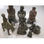 A group of various carved stone and wood figures and objects