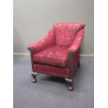 A particularly deep early 20th century armchair on claw and ball feet, recently reupholstered 95 x