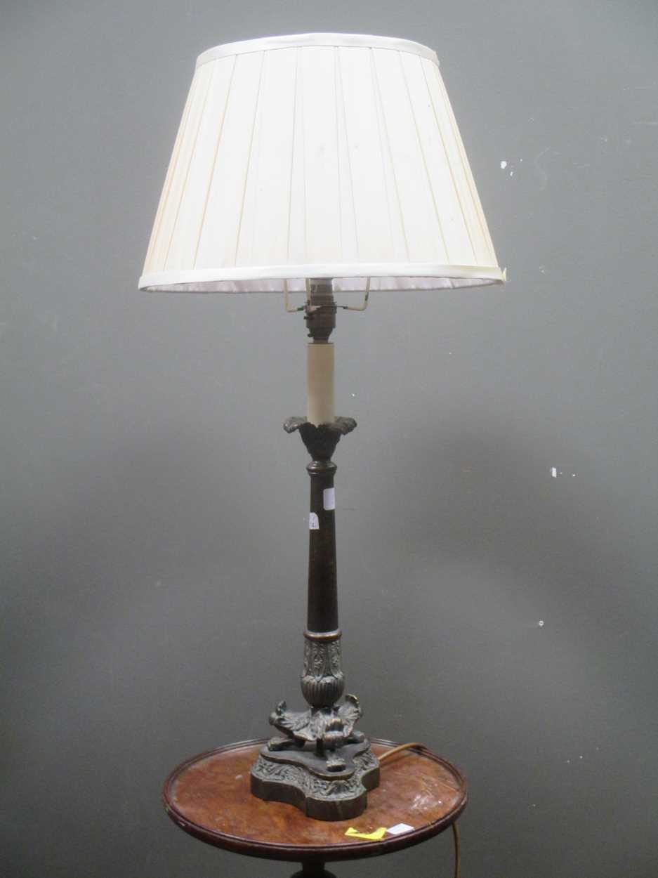 An Empire style bronze lamp, retailed by Harrods