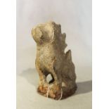 A Chinese grey stone seated Fo dog, with serrated crest in archaic style, 17cm high