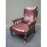 A Victorian mahogany and leather library armchair