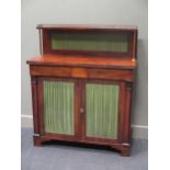 Circa 1820 a mahogany Chiffonier, the raised shelf and brass gallery over two frieze drawers and two