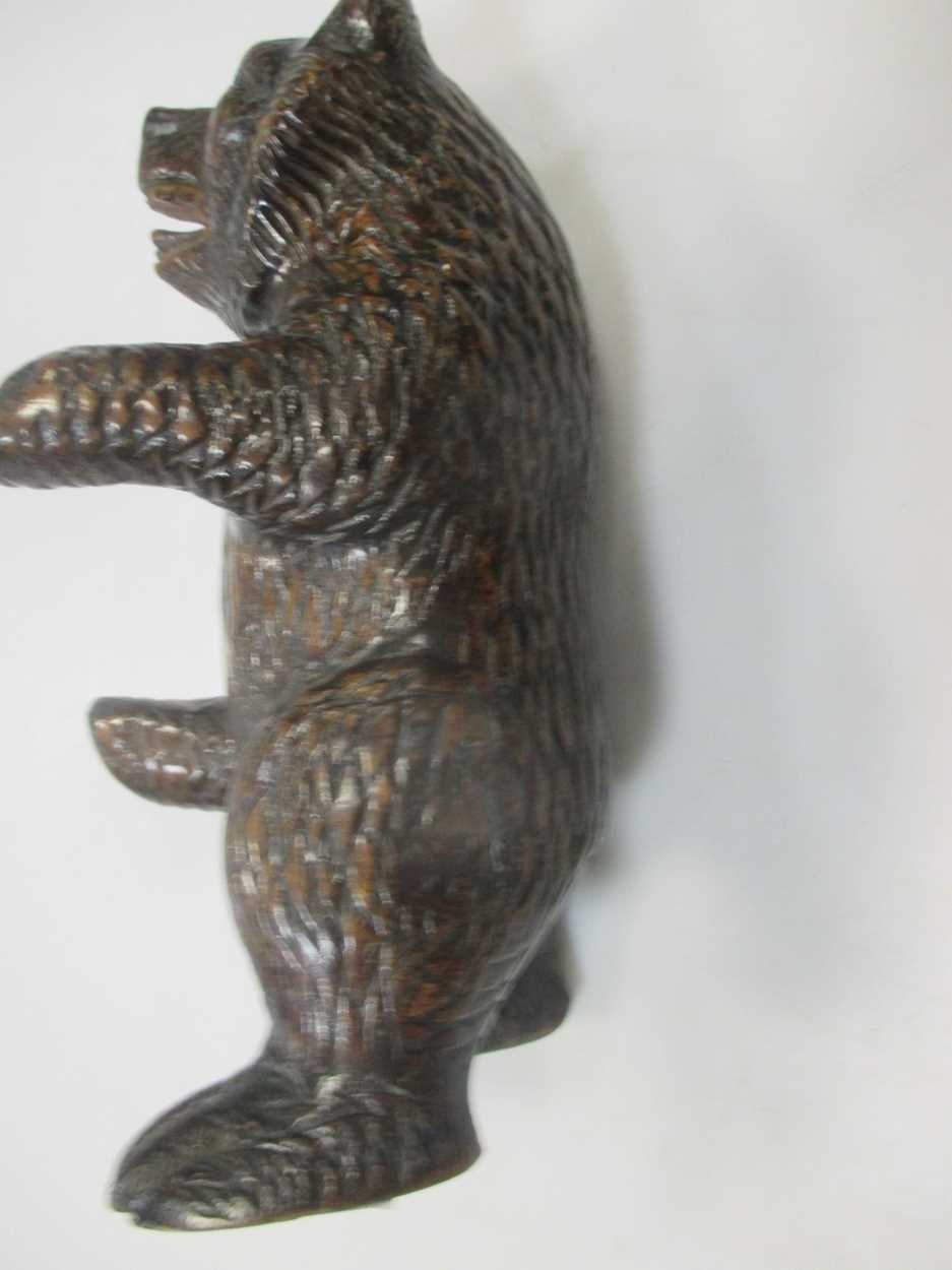 A carved walnut 'musical' bowl, probably Black Forest, and a carved model bear - Image 5 of 9