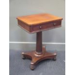 A 19th century mahogany lamp table with single frieze drawer on column support upon a quatraform
